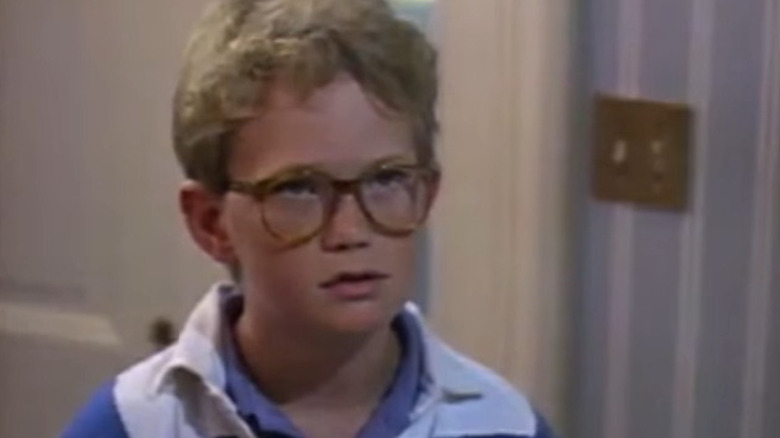 Young Neil Patrick Harris frowning, looking up