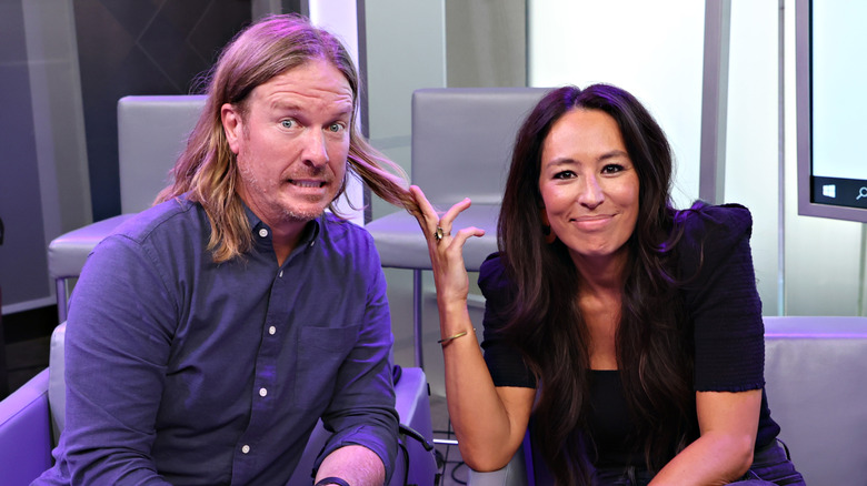 Joanna Gaines playing with Chip Gaines' hair