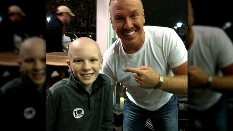 Chip Gaines posing with a patient at St. Jude Children's Research Hospital