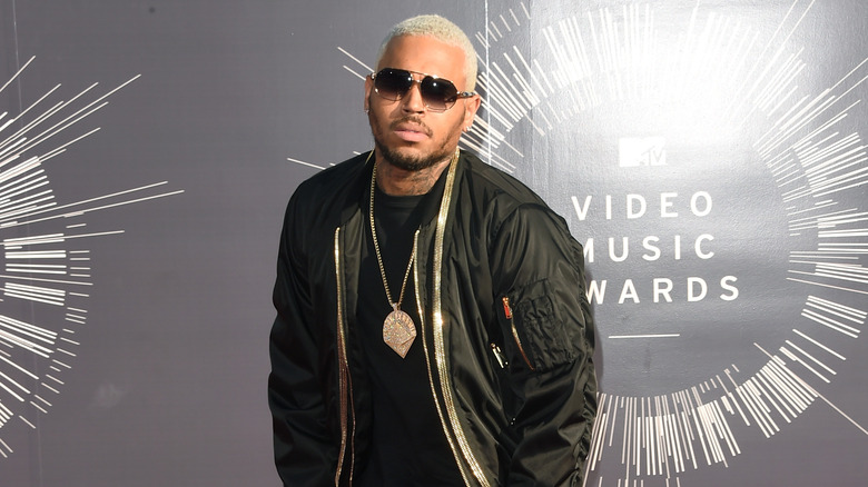 Chris Brown posing in sunglasses