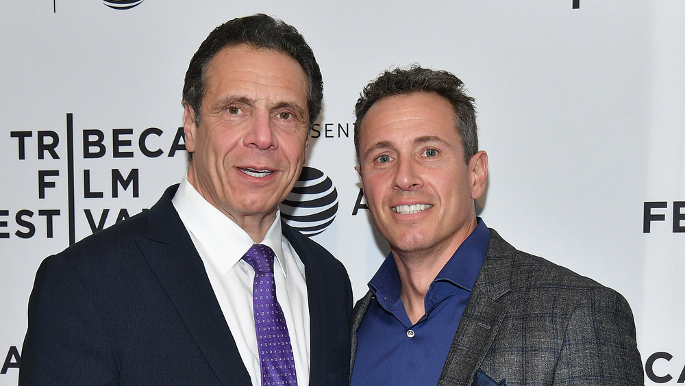 Governor of New York Andrew Cuomo and Chris Cuomo posing together on the red carpet