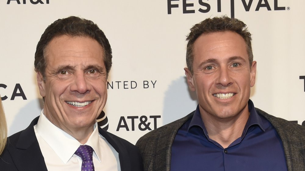 Chris and Andrew Cuomo both smiling