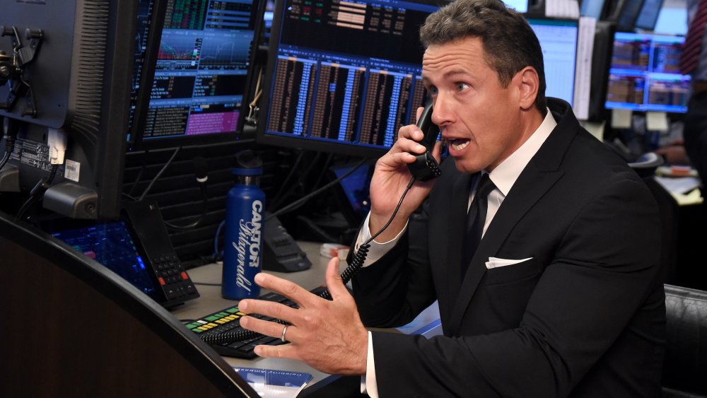  Chris Cuomo on the phone in office