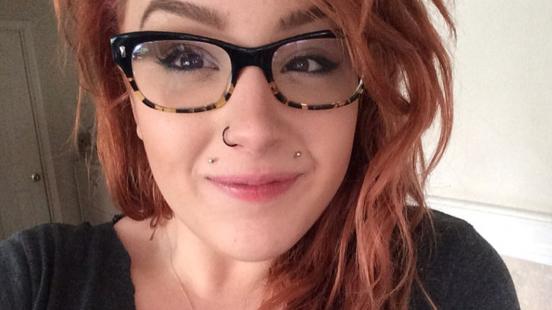 Hannah Price glasses red hair smiling