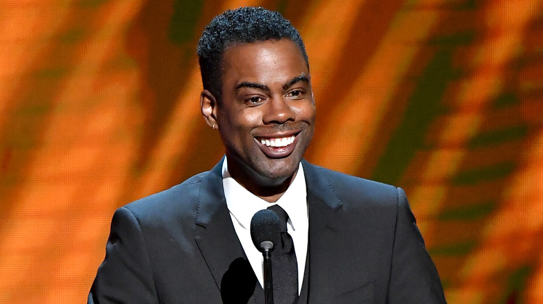 Chris Rock smiling onstage