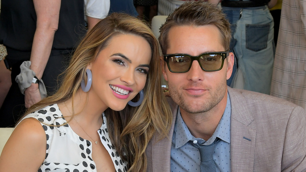 Chrishell Stause and Justin Hartley posing together at an event