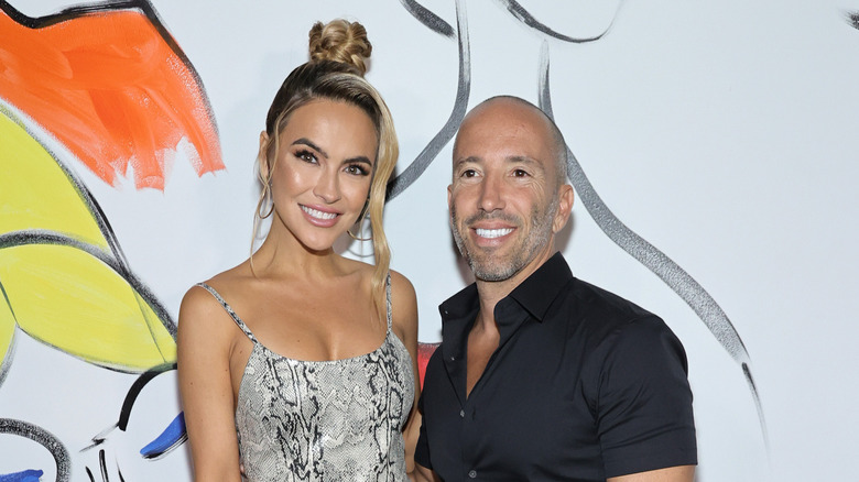 Chrishell Stause poses with Jason Oppenheim 