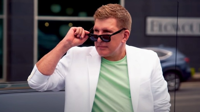 Todd Chrisley pulling sunglasses down