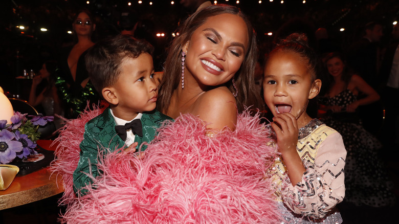 Chrissy Teigen posing with her kids