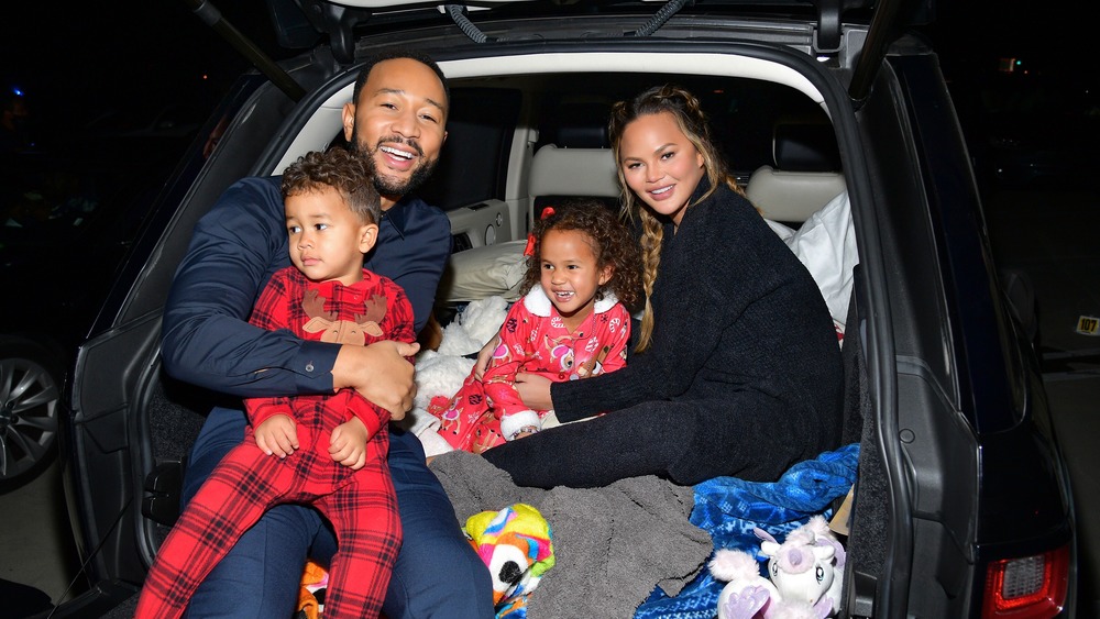 Chrissy Teigen with her family in a car