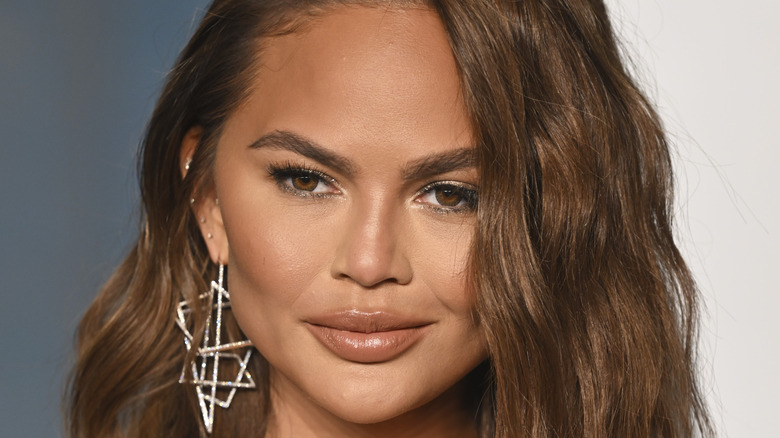 Chrissy Teigen at a vanity fair oscars party 