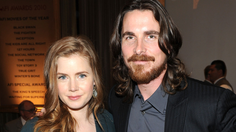 Amy Adams and Christian Bale posing