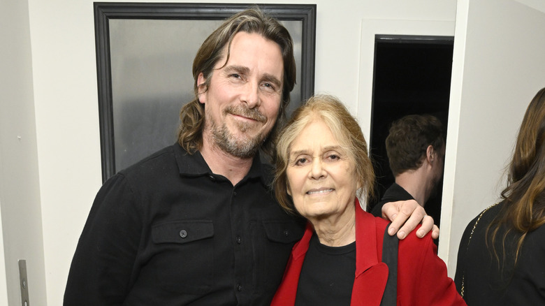 Christian Bale arm over Gloria Steinem