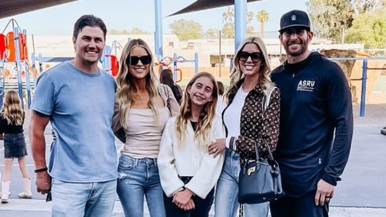 The Hall- El Moussa family stand together at park