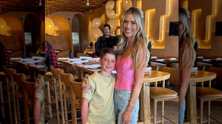 Christina Hall posing with her son