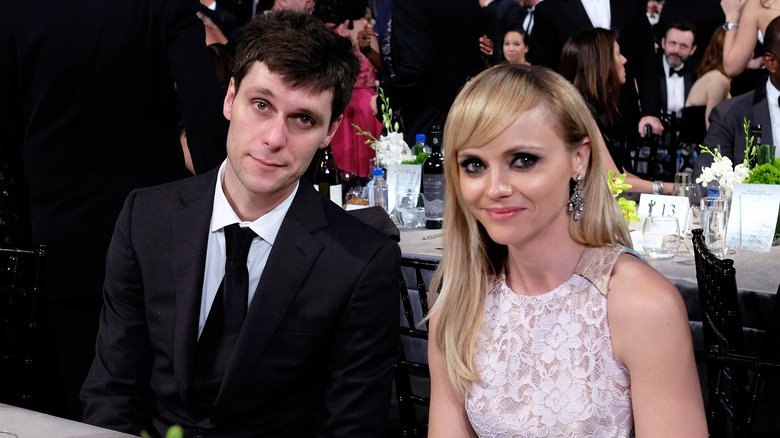 Christina Ricci and James Heerdegen at a table