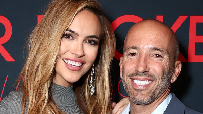 Chrishell Strause and Jason Oppenheim at a press event 