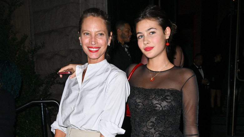 Christy Turlington and Grace Burns with red lipstick