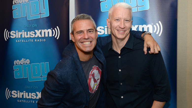 Andy Cohen (L) and Anderson Cooper posing for photo at "Andy Cohen Live!" 