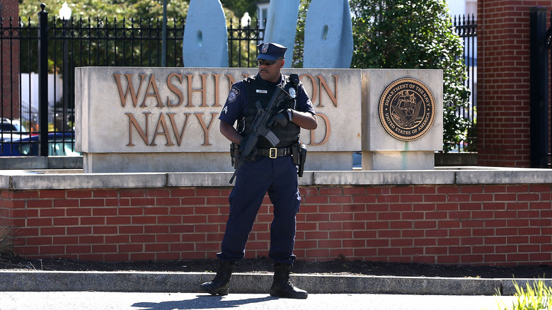 Police officer standing guard at the Washington Navy Yard in 2013