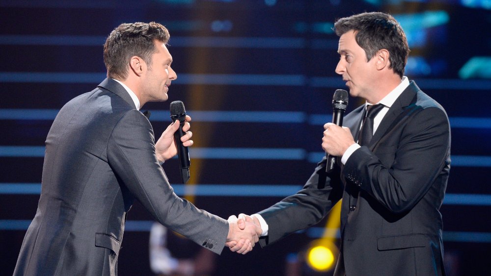 Ryan Seacrest, Brian Dunkleman shaking hands during the finale for the farewell season of American Idol 