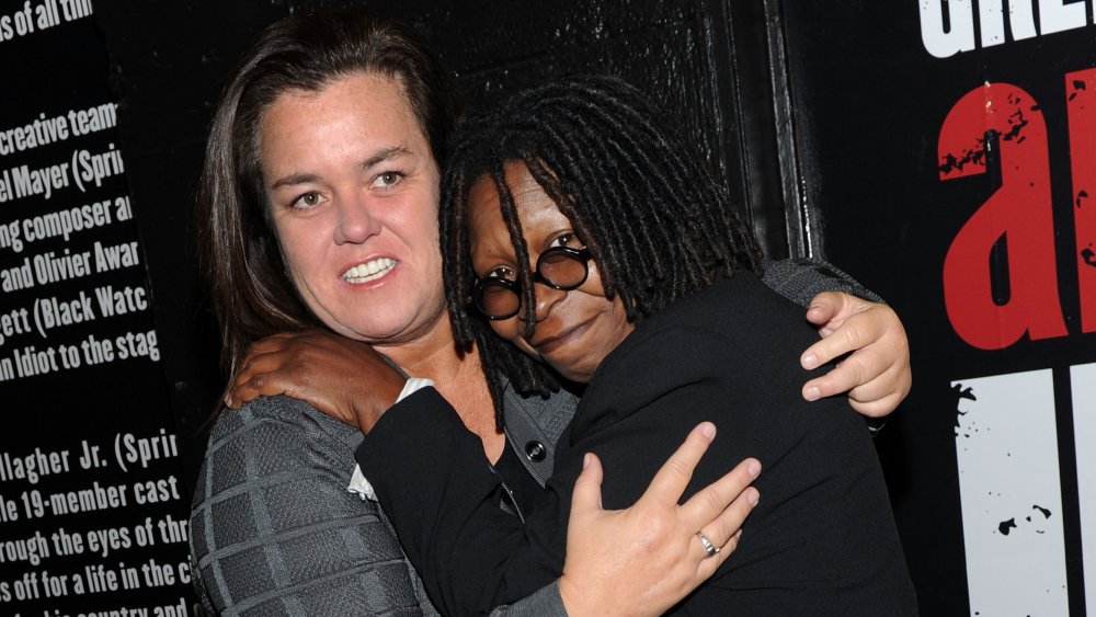 Rosie O'Donnell and Whoopi Goldberg hugging at the Broadway opening of American Idiot