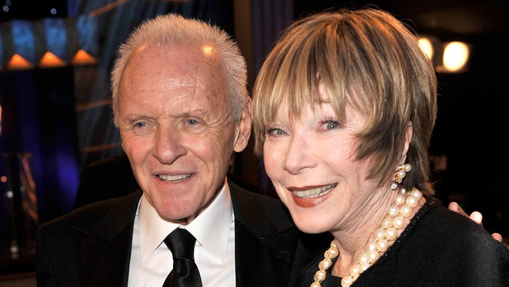 Anthony Hopkins and Shirley MacLaine both smiling 