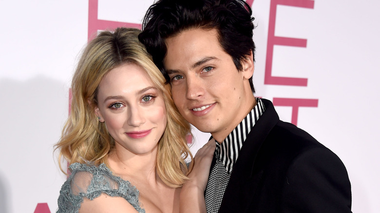 Lili Reinhart and Cole Sprouse hugging on red carpet