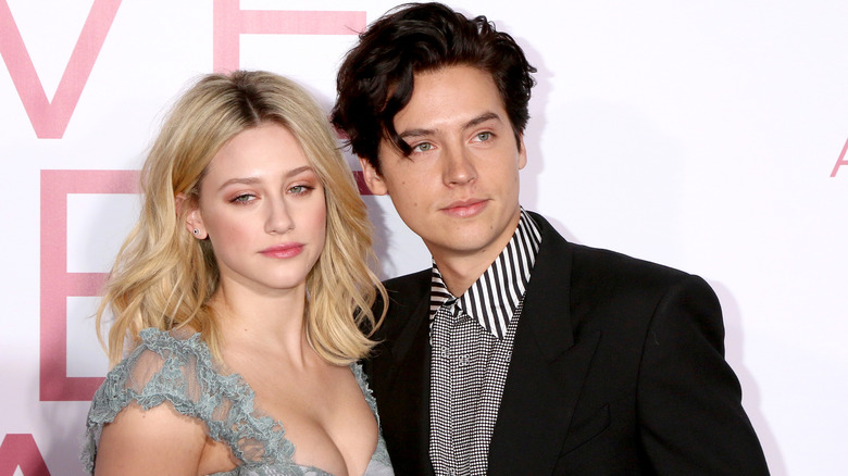 Cole Sprouse and Lili Reinhart pose 