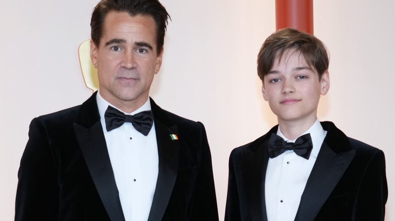 Colin Farell and Henry Farell pose