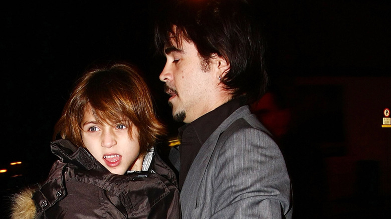 Colin Farrell holding son James