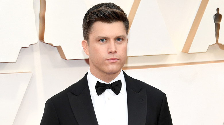 Colin Jost poses 