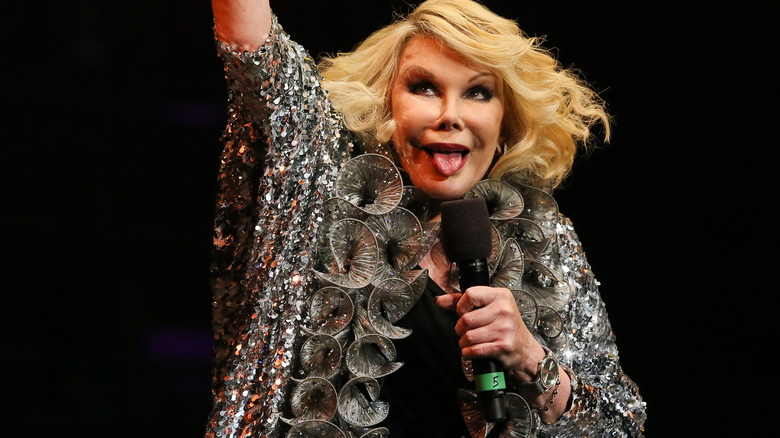 Joan Rivers performing with tongue out