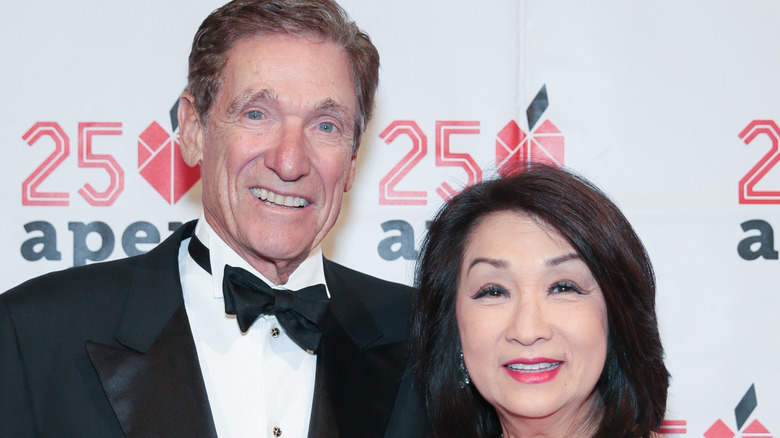 Connie Chung and Maury Povich smiling at event