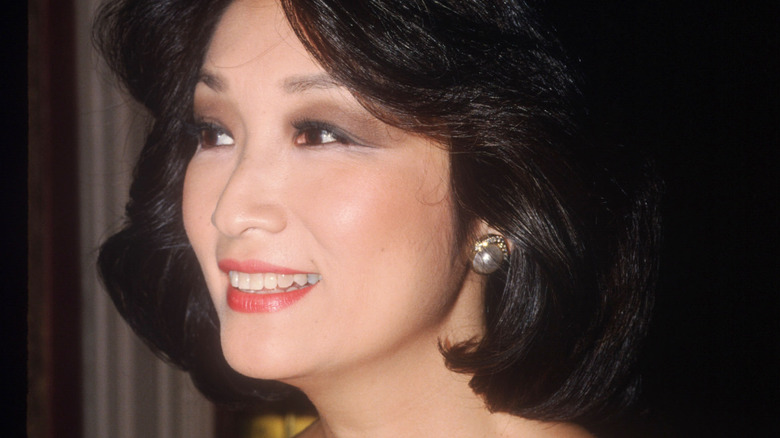 Connie Chung smiling and looking away from the camera at event