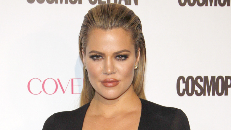 Khloe Kardashian smirking 