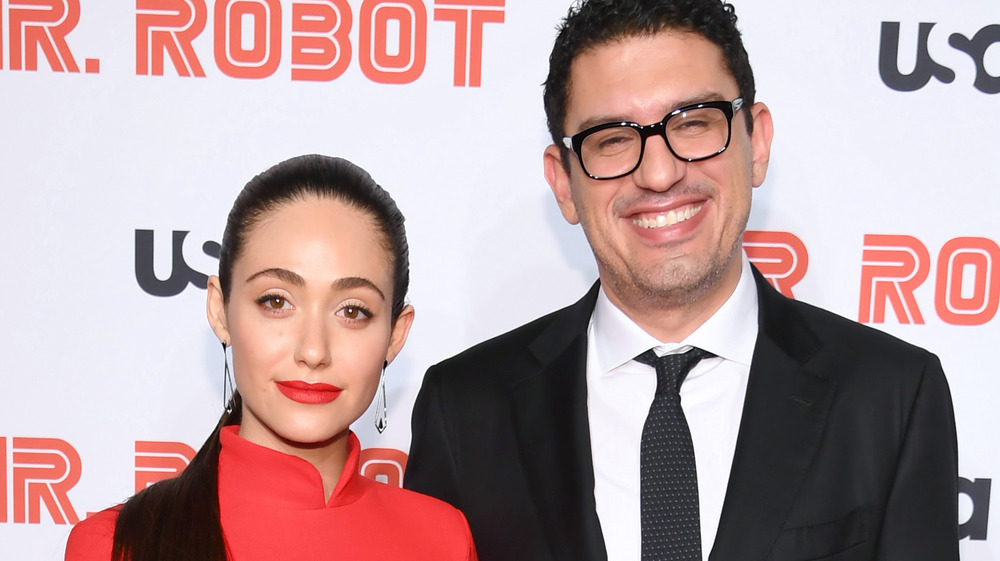 Emmy Rossum and Sam Esmail posing on the red carpet