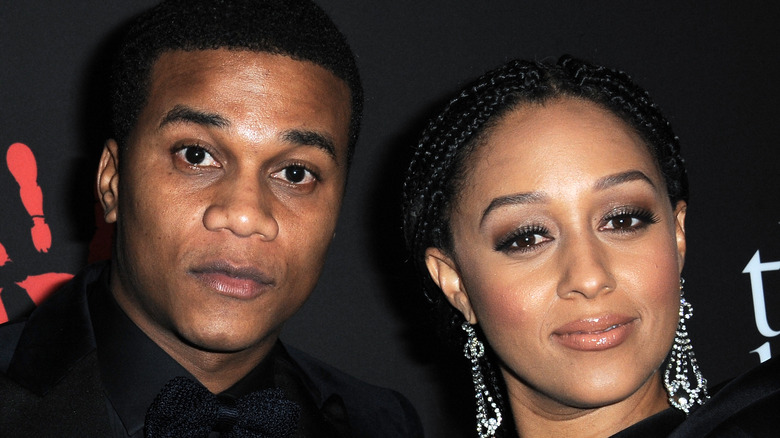 Cory Hardrict and Tia Mowry posing for cameras at a gala 