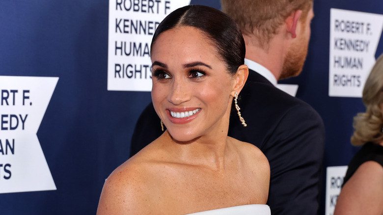 Meghan Markle turning and smiling
