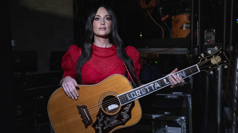 Kacey Musgraves holding guitar