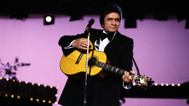 Johnny Cash playing guitar