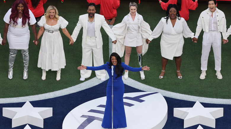 Mickey Guyton performing with backup singers