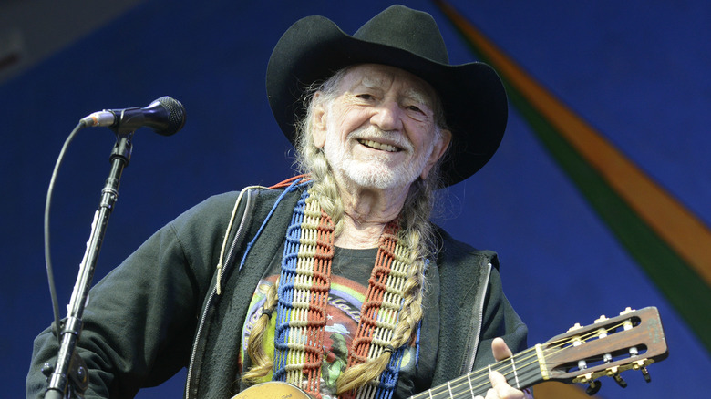 Willie Nelson playing guitar