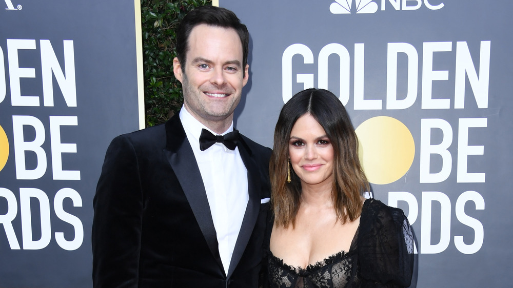 Bill Hader and Rachel Bilson smiling while arm in arm