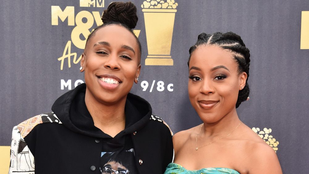 Lena Waithe and Alana Mayo smiling while posing arm in arm