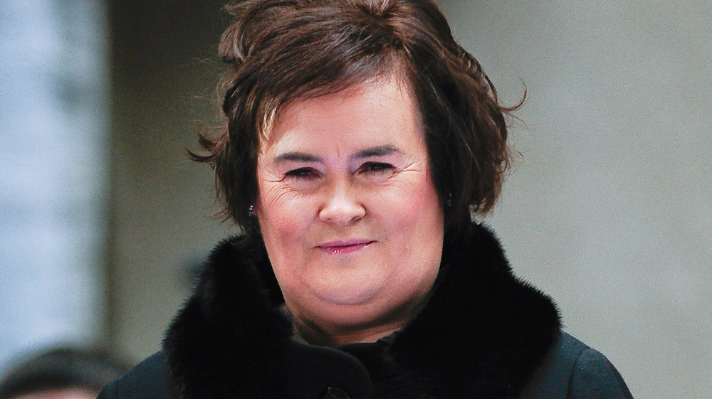 Susan Boyle with a slight smile 