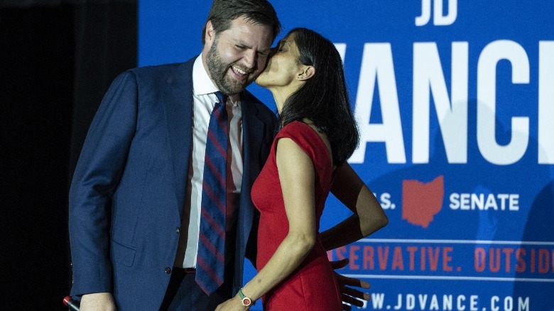 JD Vance receives a kiss on the cheek from Usha Vance at a rally