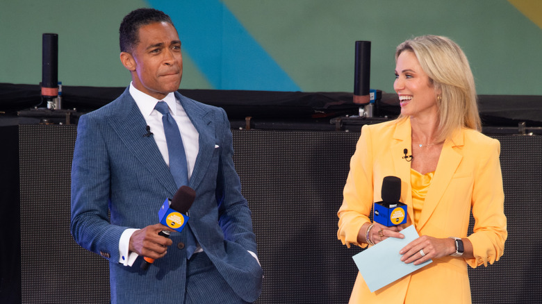 T.J. Holmes and Amy Robach with mics
