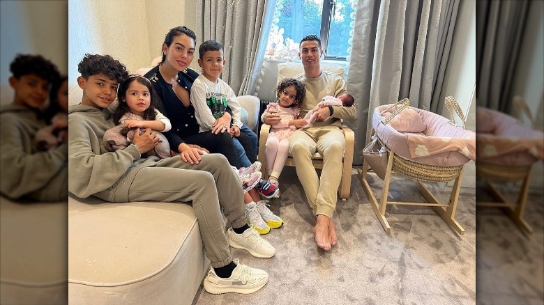 Cristiano Ronaldo with his family on a couch