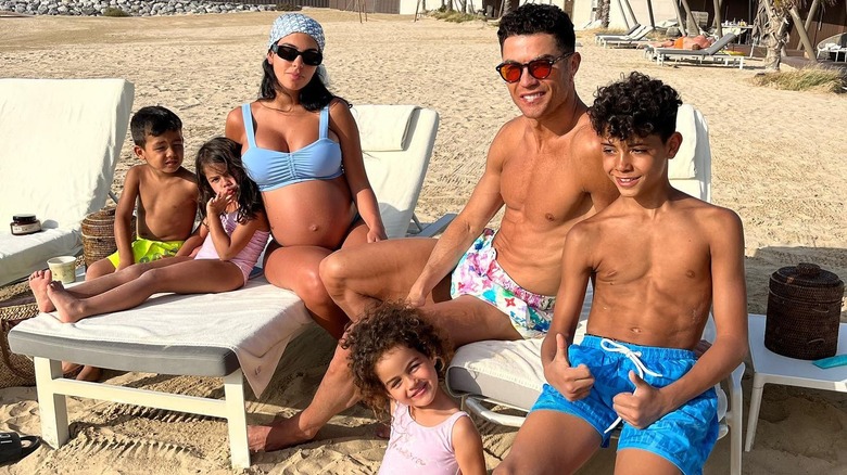 Cristiano Ronaldo and Georgina Rodriguez with their four children at the beach